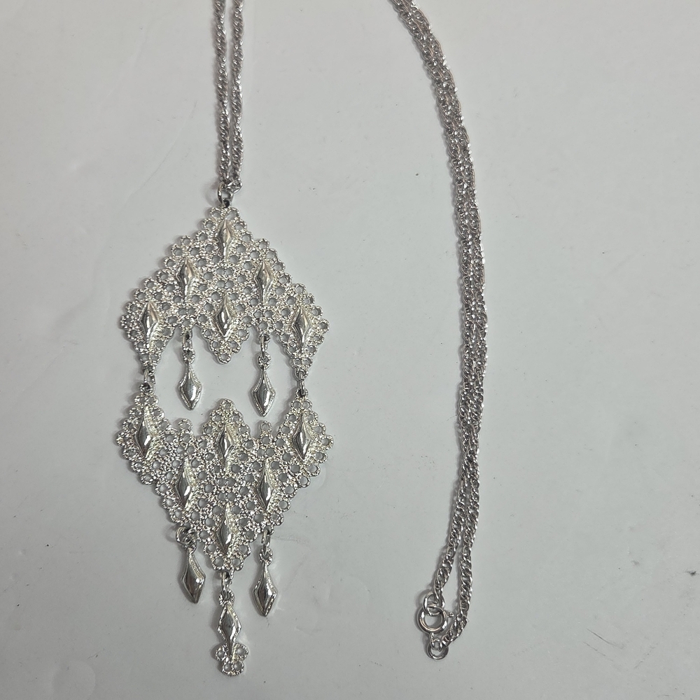 long silver tone articulated pendant necklace filigree dangel unmarked elegant